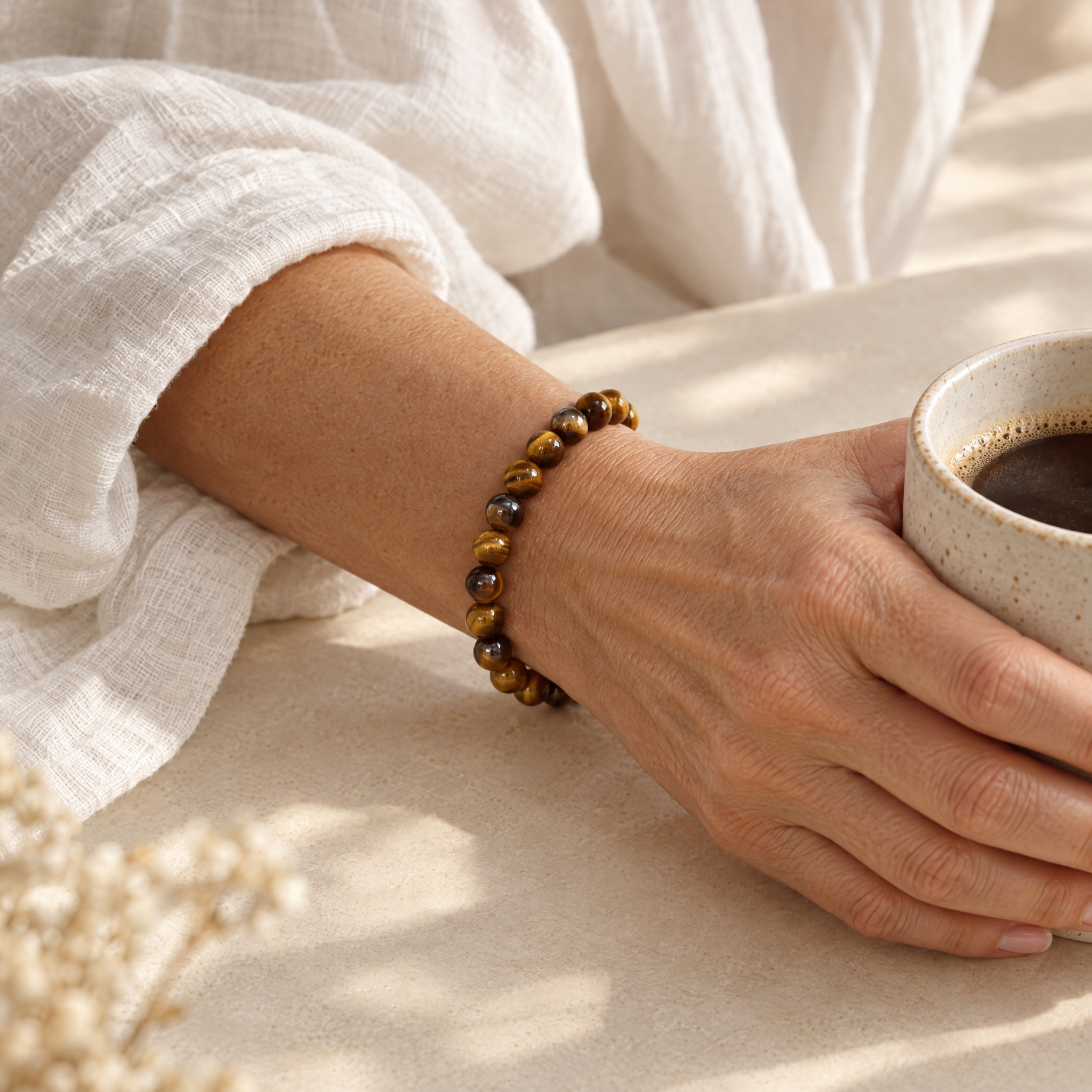 Woman wearing the tiger's eye bracelet in soft daylight