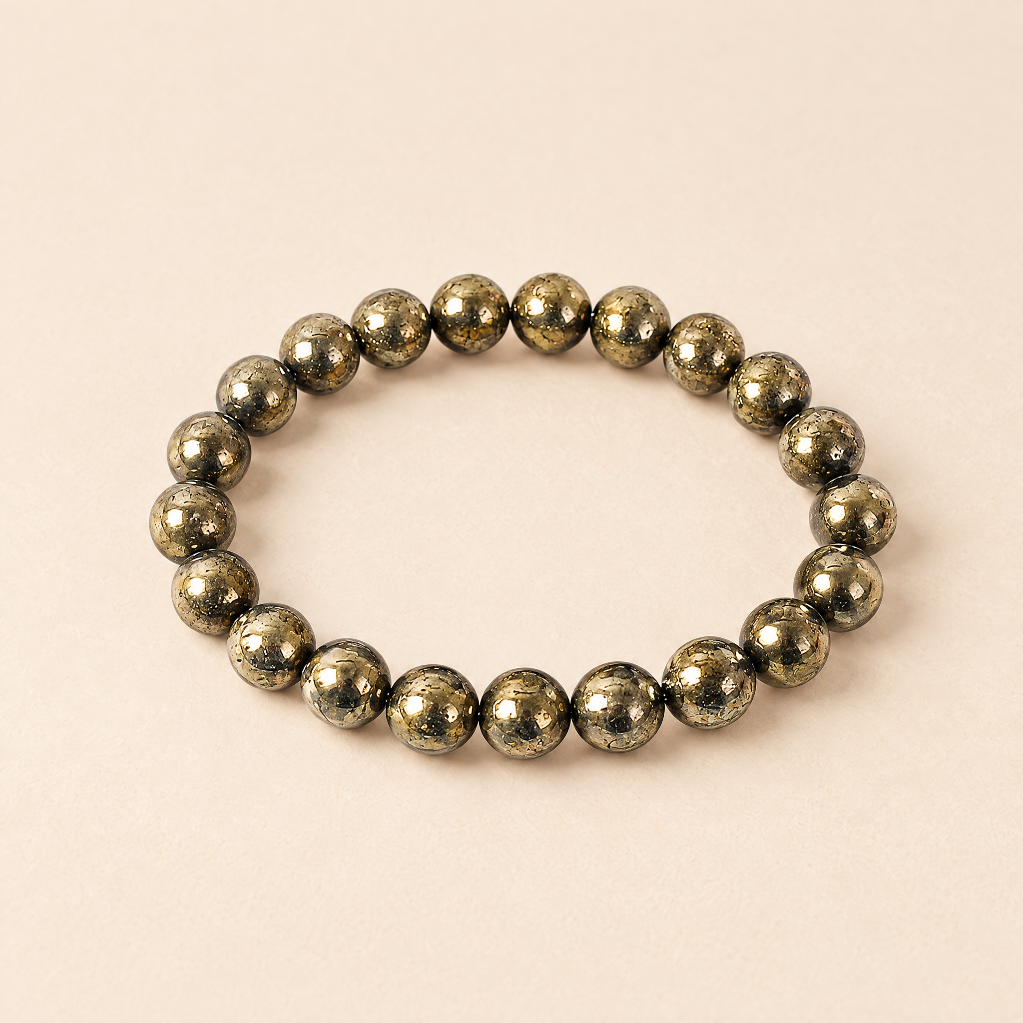 Abundance pyrite bracelet on a cream background