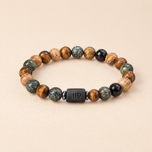 Written in the Stars zodiac bracelet on a cream background
